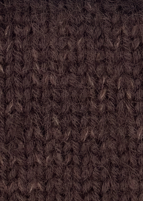 Close-up of brown merino wool and mohair hand-knit fabric.