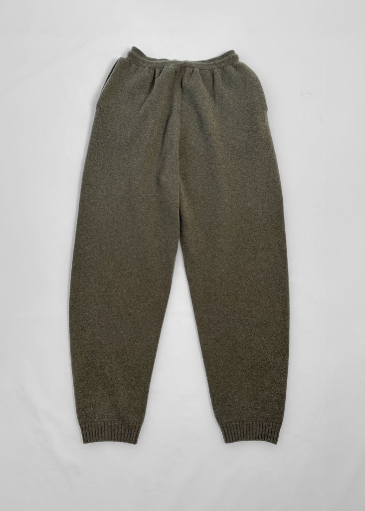 green knitted pants on a light gray background