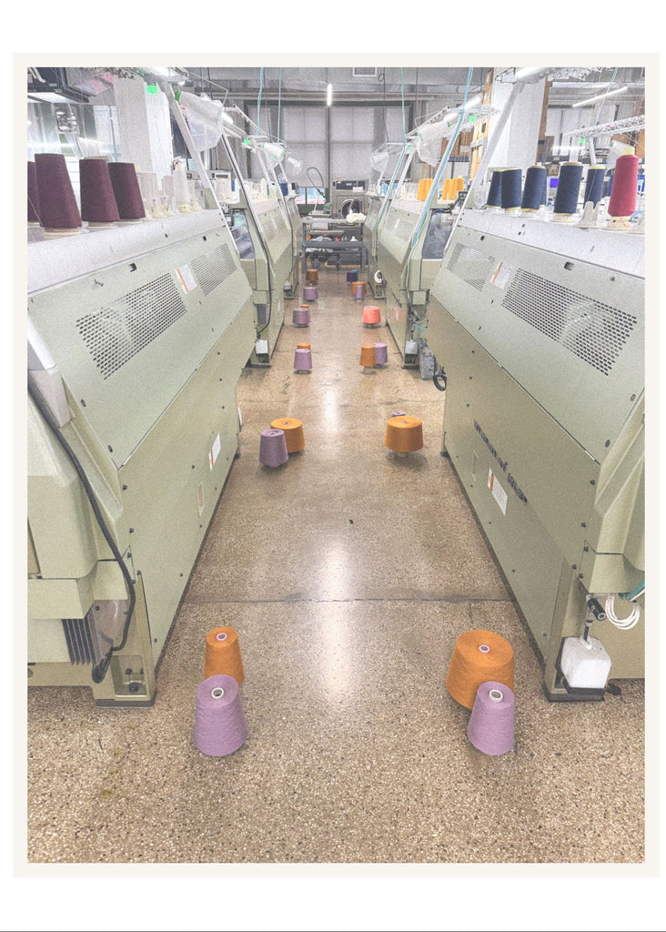 Textile production line with machines and spools of thread in a factory setting